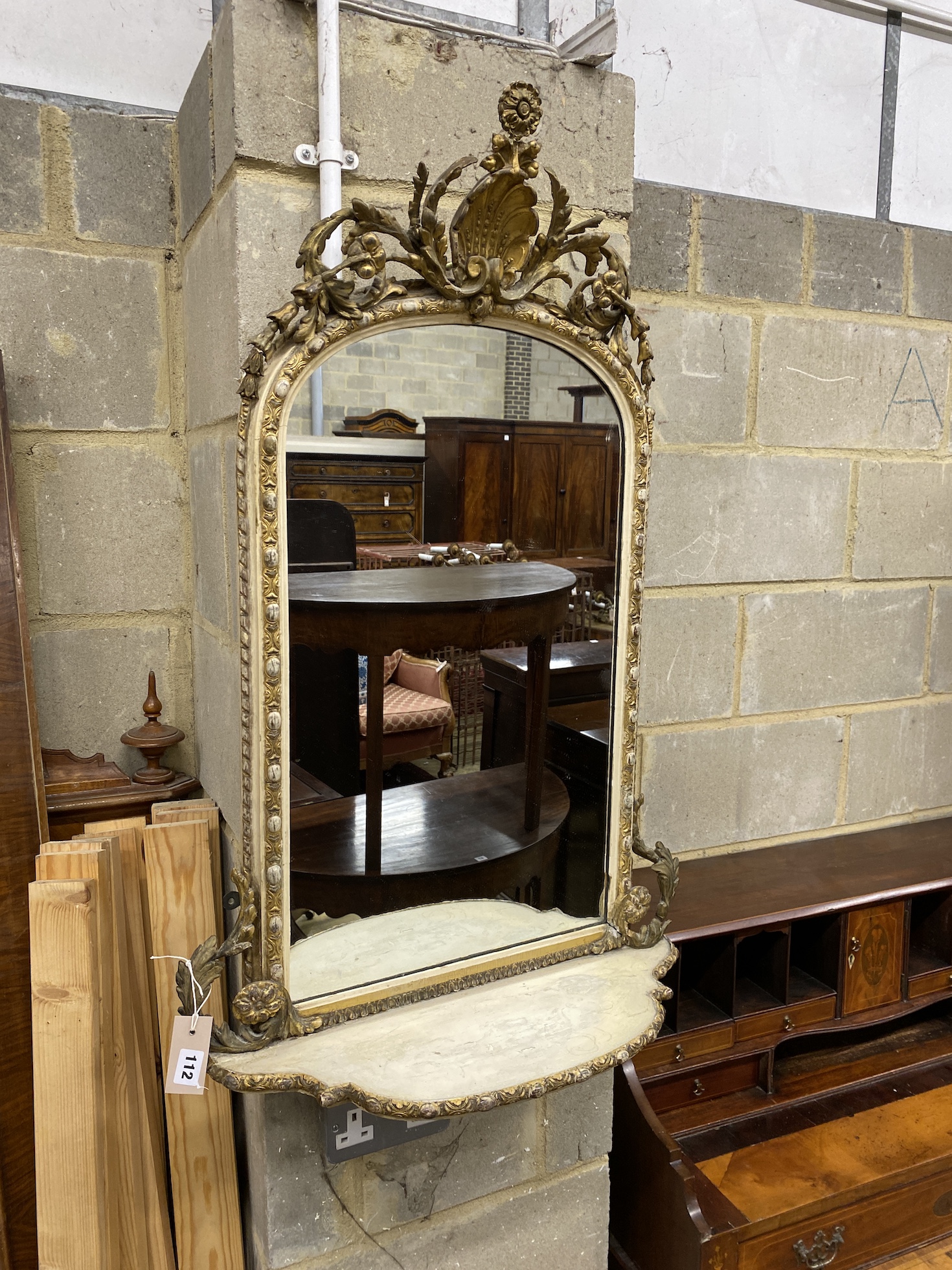 A Victorian later painted giltwood and composition wall mirror, width 59cm, height 90cm